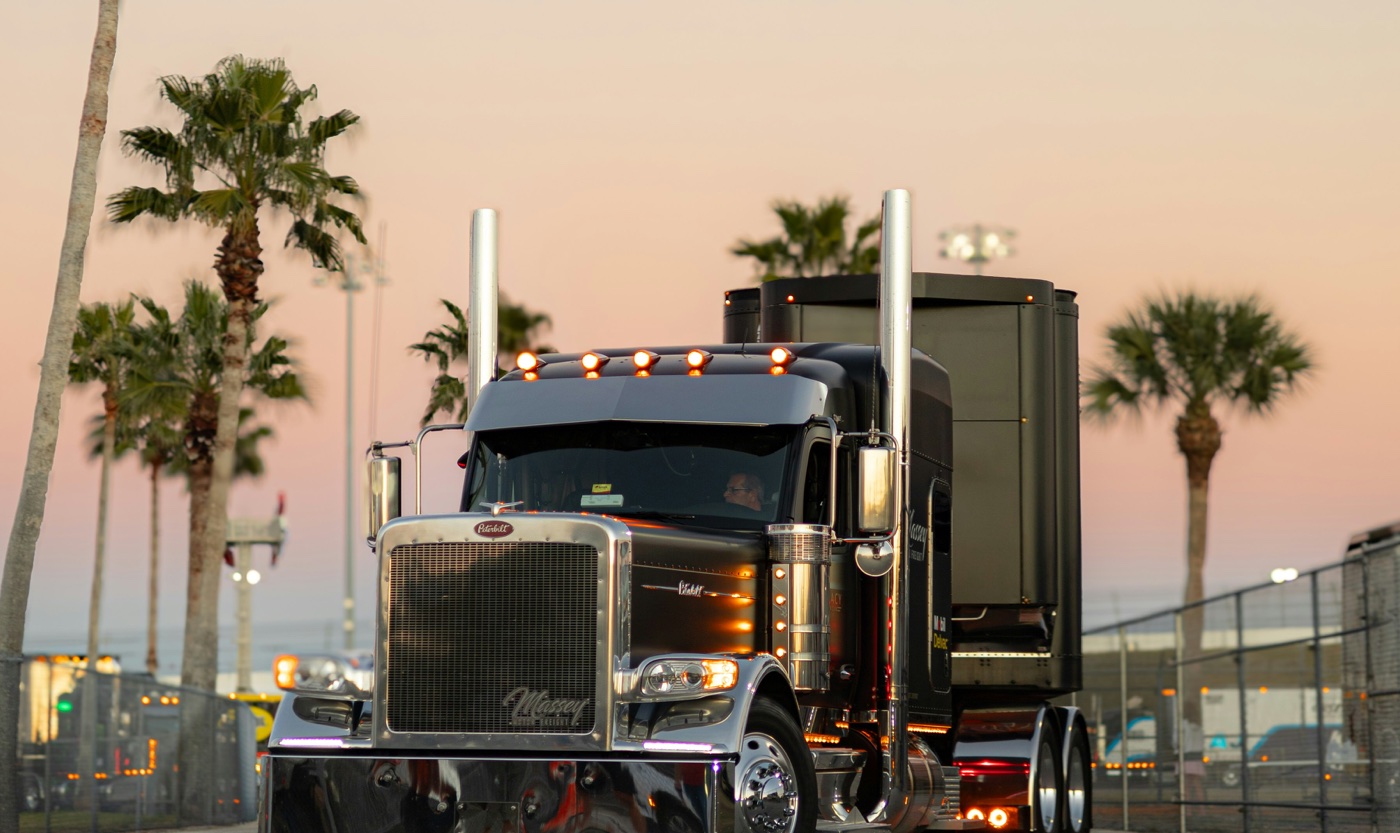 Black Peterbilt conventional-cab semi truck