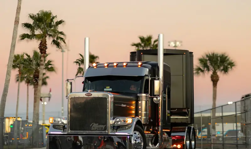 Black Peterbilt conventional-cab semi truck